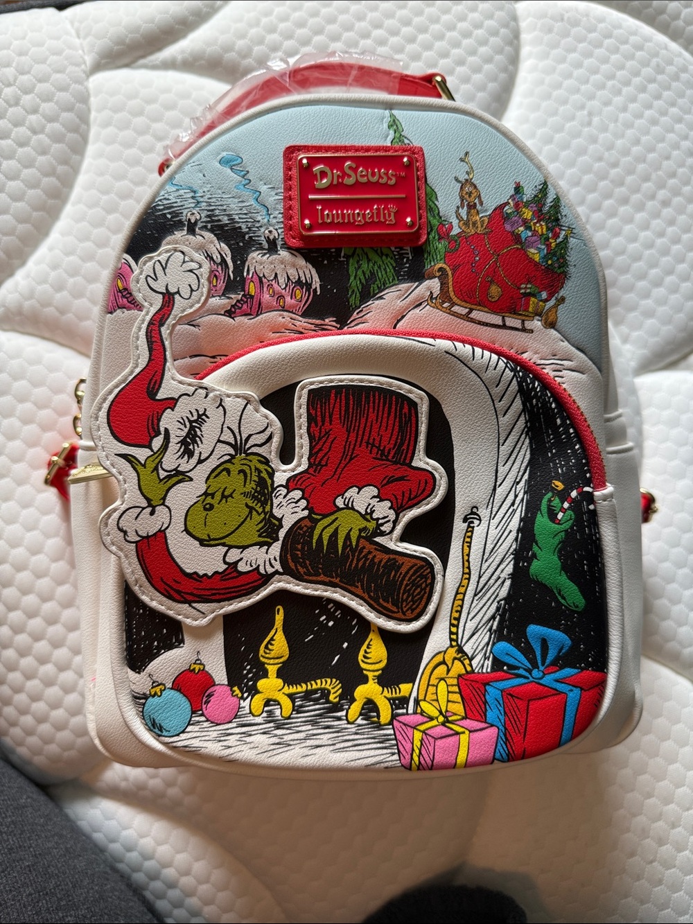 Loungefly Dr. Seuss White Mini Backpack with Multicolor Grinch Graphics